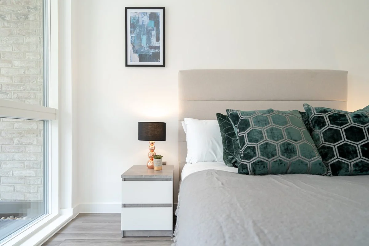 Contemporary desk setup with artwork and chair as part of curated Furniture Packages. give in humanised way