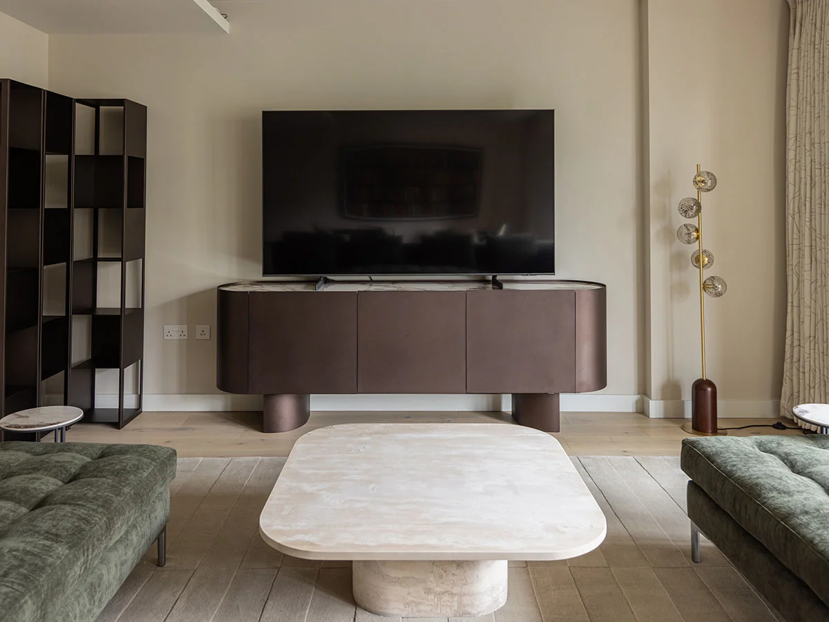 Professional interior design transformation of a London living room featuring modern furniture.