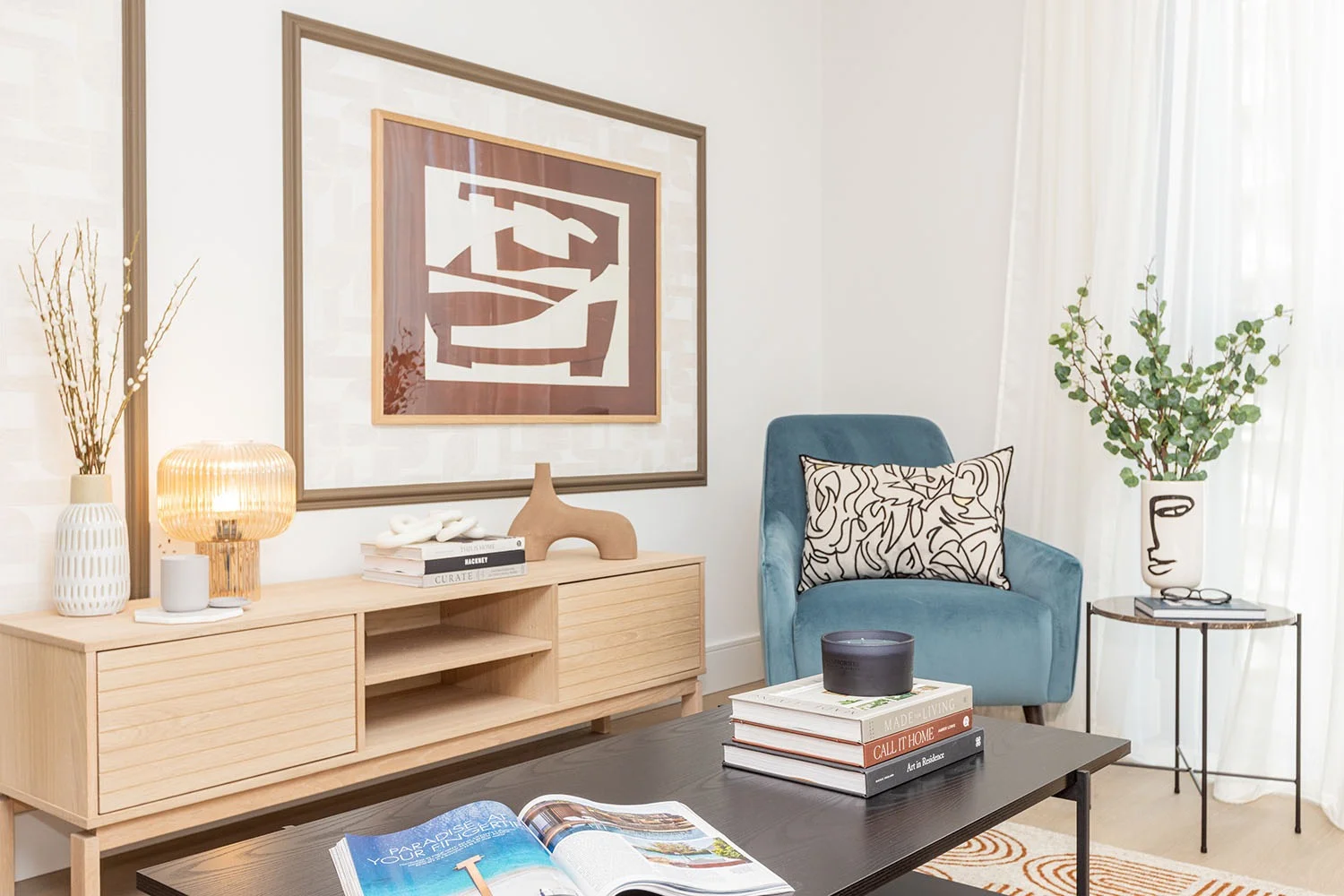 living room with furniture and blue chair