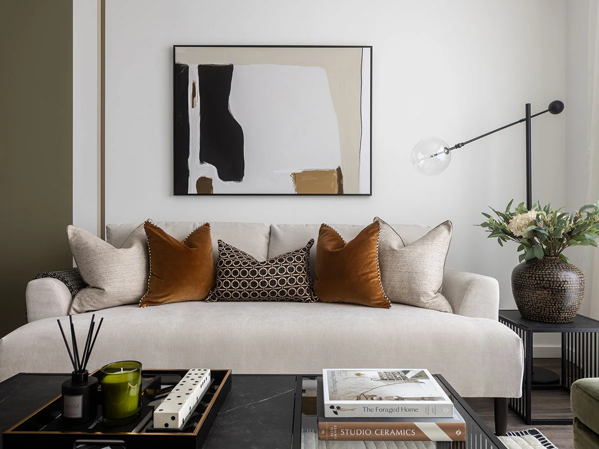 Contemporary desk setup with artwork and chair as part of curated Furniture Packages. give in humanised way