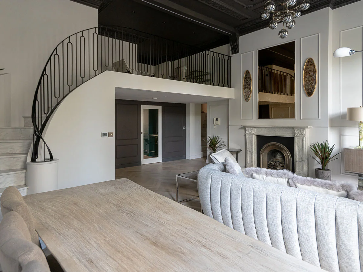 Luxury living room with a spiral staircase and high ceilings