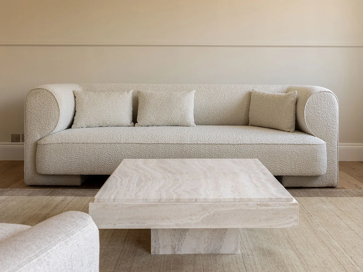 Modern living room transformation with neutral tones creating a spacious and contemporary feel