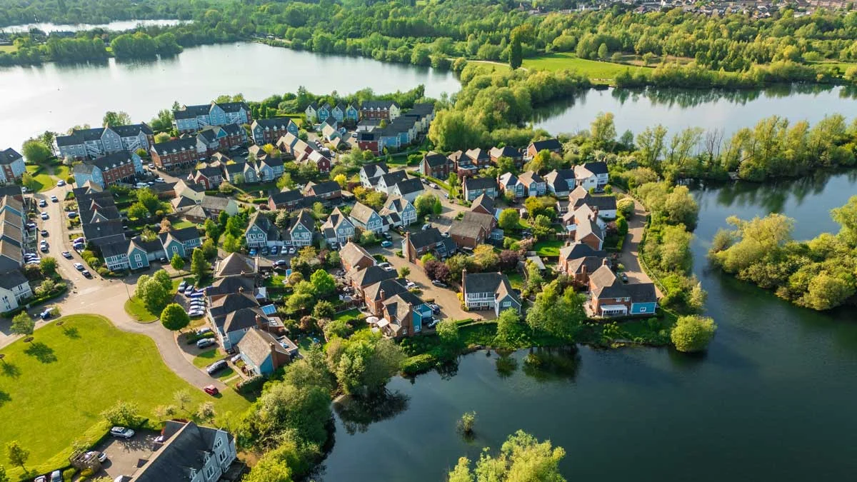 A professional project management consultation for property furnishing, featuring a team member from InStyle Direct reviewing interior design plans and schedules on a tablet in London