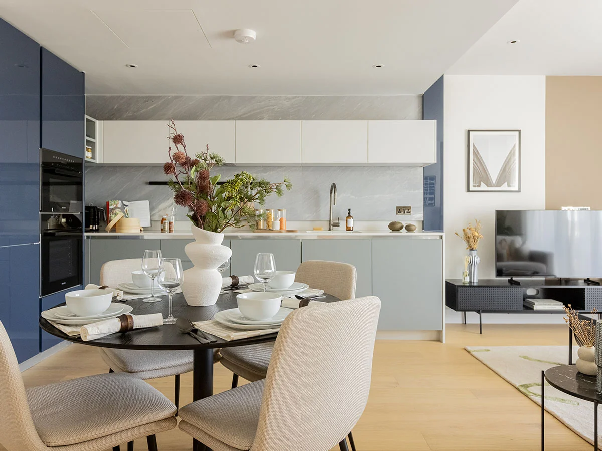 Open plan kitchen and dining area in White City London apartment with modern interior styling