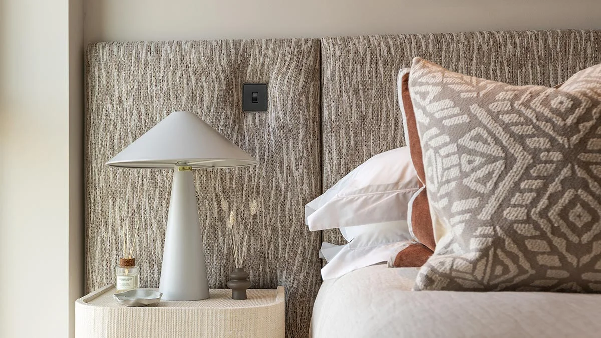 Stylish sales suite interior design showcasing green velvet chairs and sofa. Highlights furnishing packages appeal