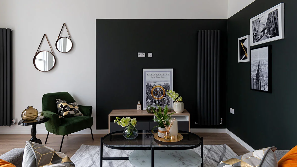Contemporary build-to-rent living room with dark feature wall and modern furniture