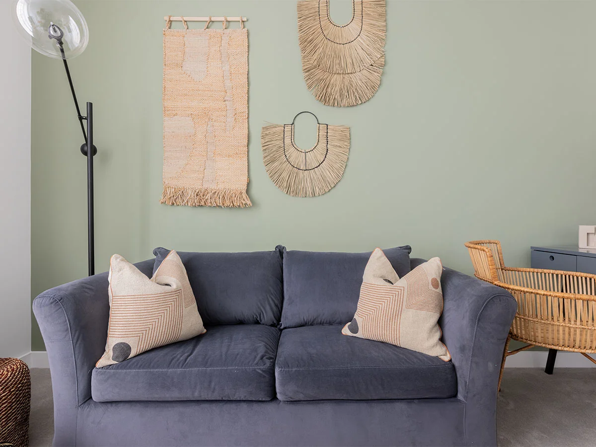 Living room in show home styled with soft furnishings to achieve a high-end look on a budget