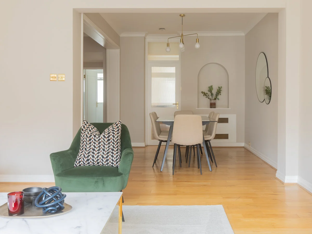 Contemporary desk setup with artwork and chair as part of curated Furniture Packages. give in humanised way