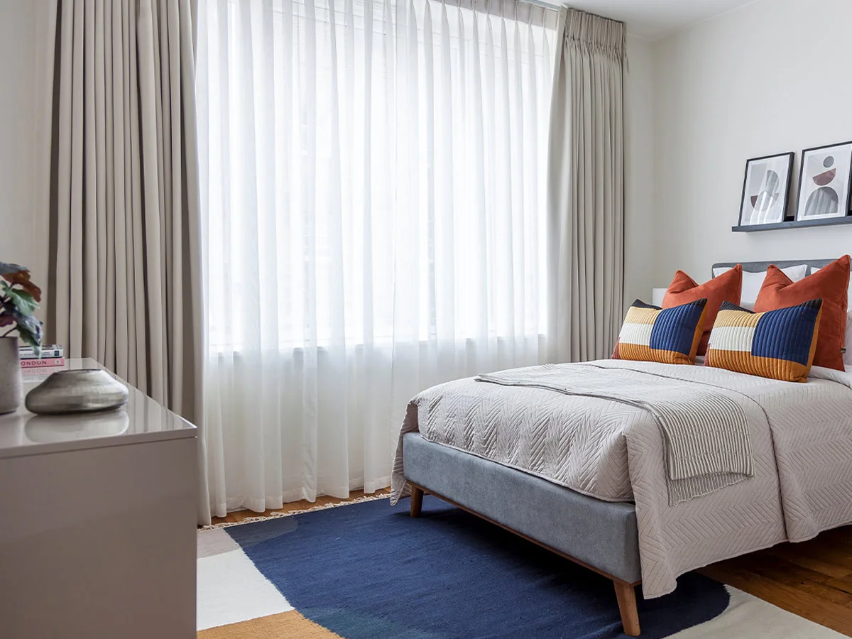 Elegant gold accent tables and soft neutral décor styled to reflect premium furnishing and interior design services