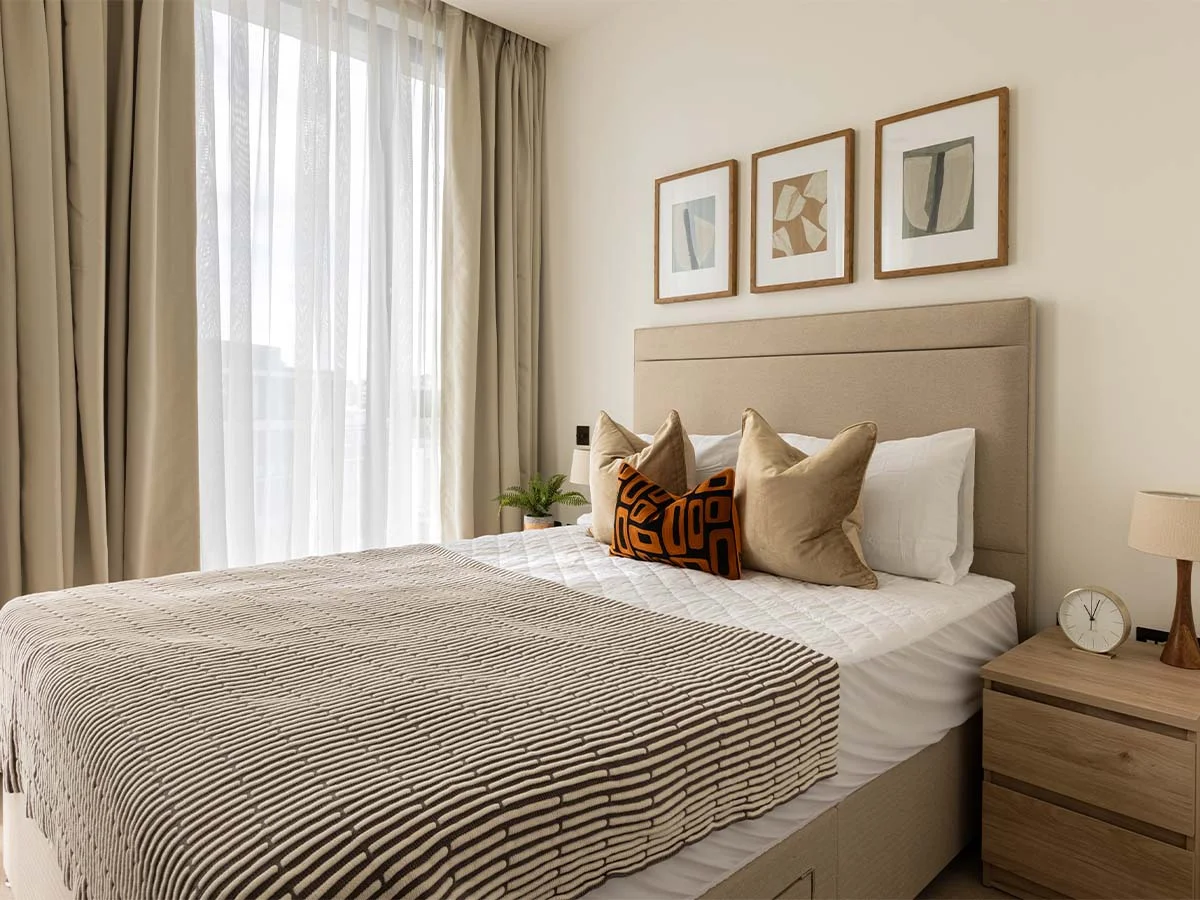 bedroom with painting and window dressing of Pembridge Gardens, Notting Hill
