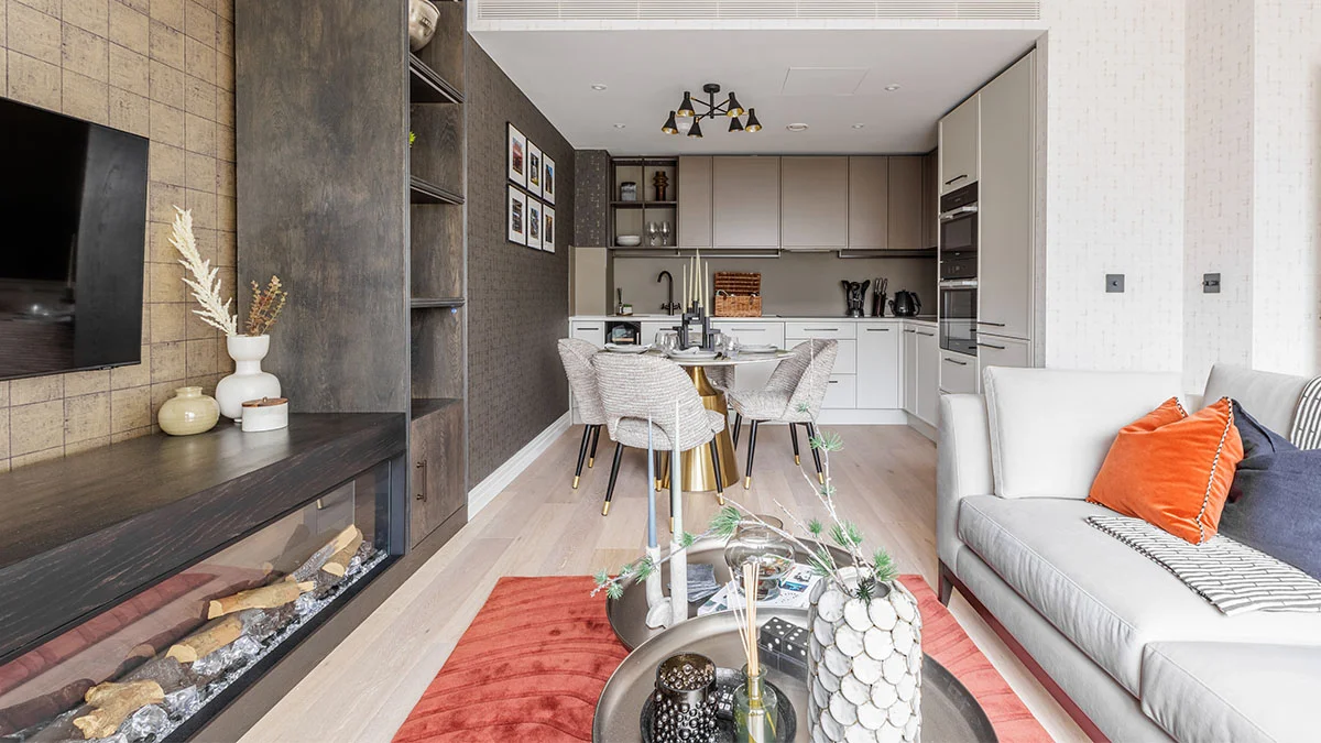 A professionally staged open-plan kitchen and living area in London featuring contemporary furniture.