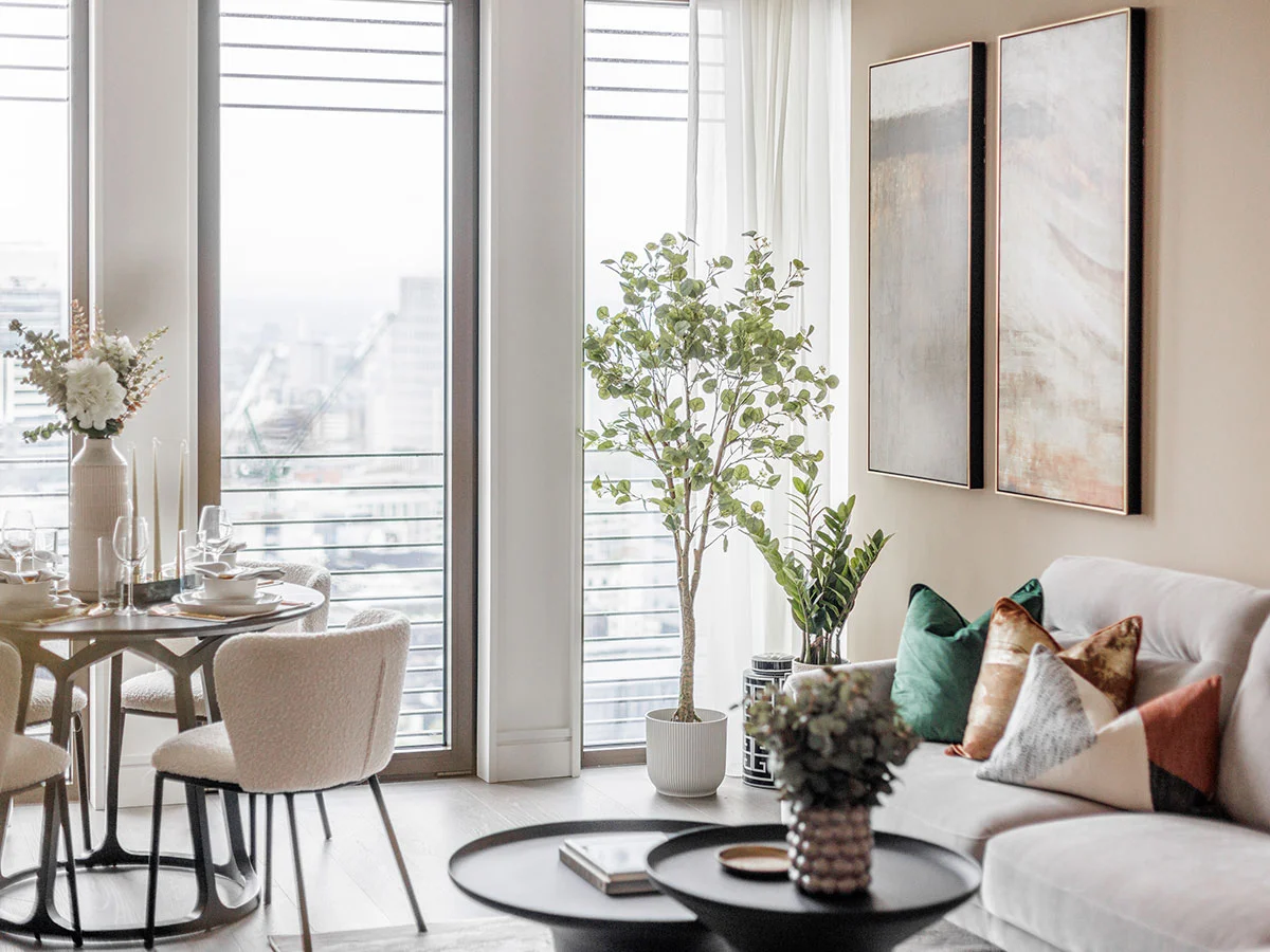 Modern open-plan apartment featuring a stylish dining setup and contemporary living area, showcasing Long-Let Furniture Packages in Dubai designed for comfort and elegance