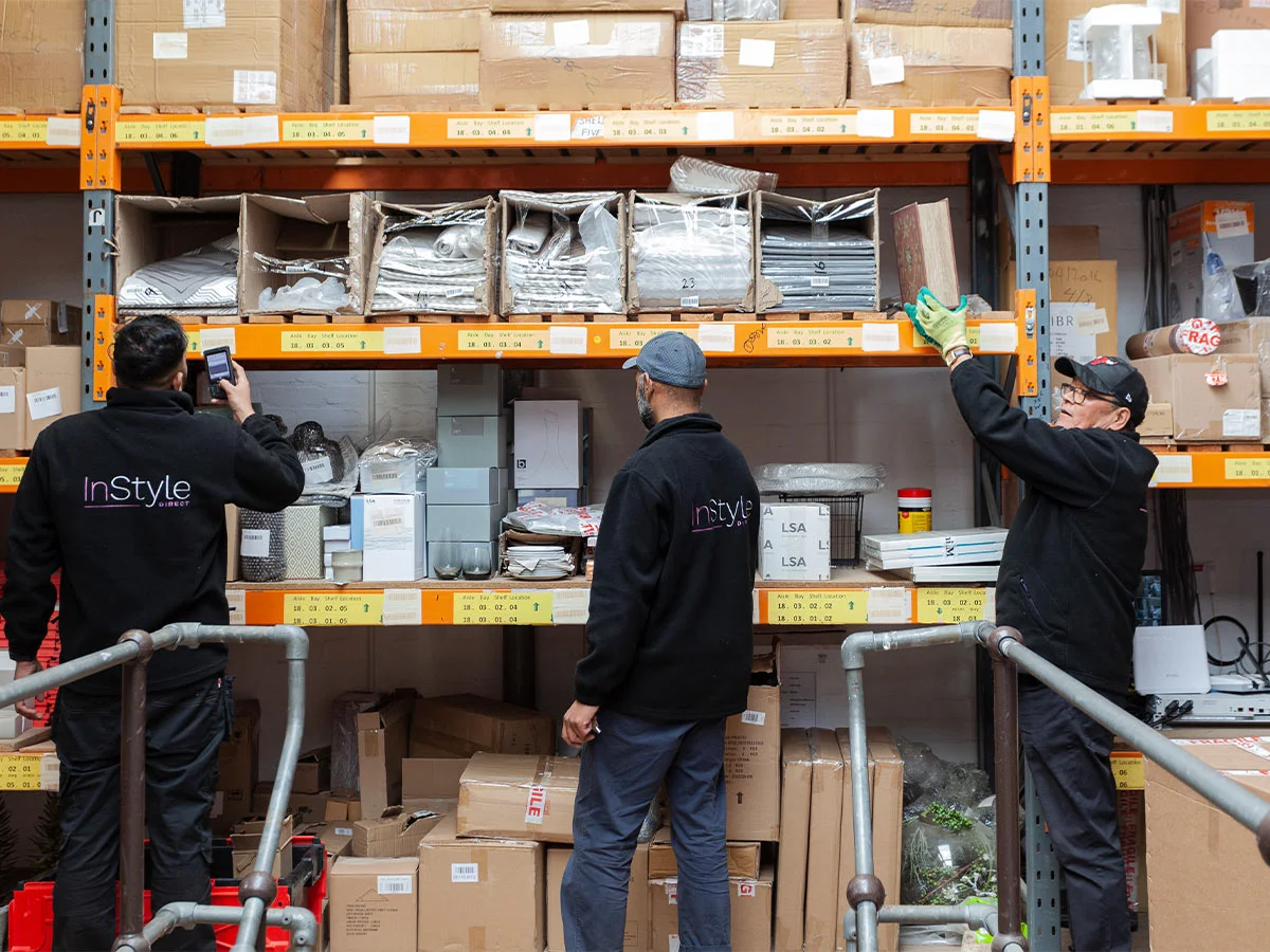 build to rent logistics team managing furniture inventory and installation process in warehouse
