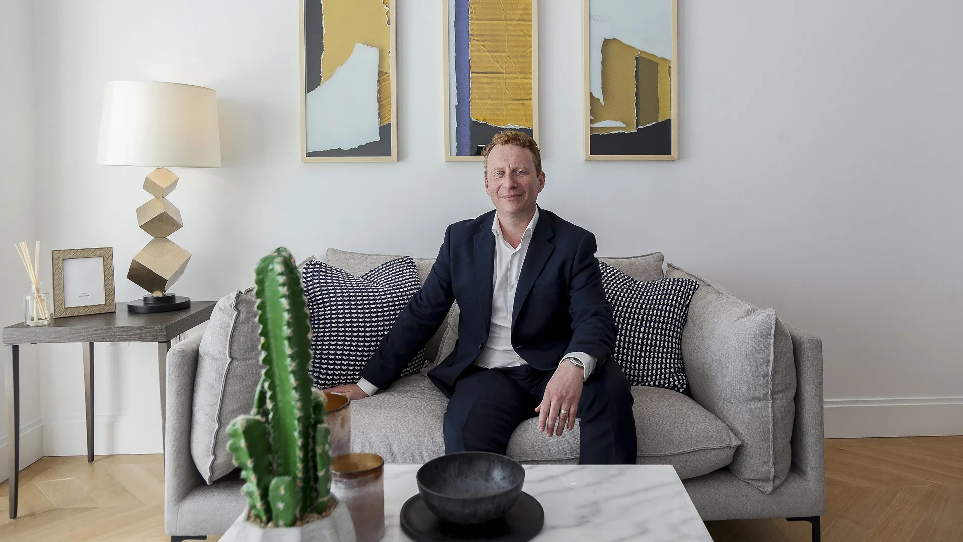Professional sitting in modern commercial interior space