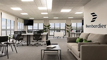 A modern commercial office interior by InStyle Direct for Bombardier HQ, featuring ergonomic black mesh chairs, white workstations, and a grey lounge sofa with green velvet cushions.