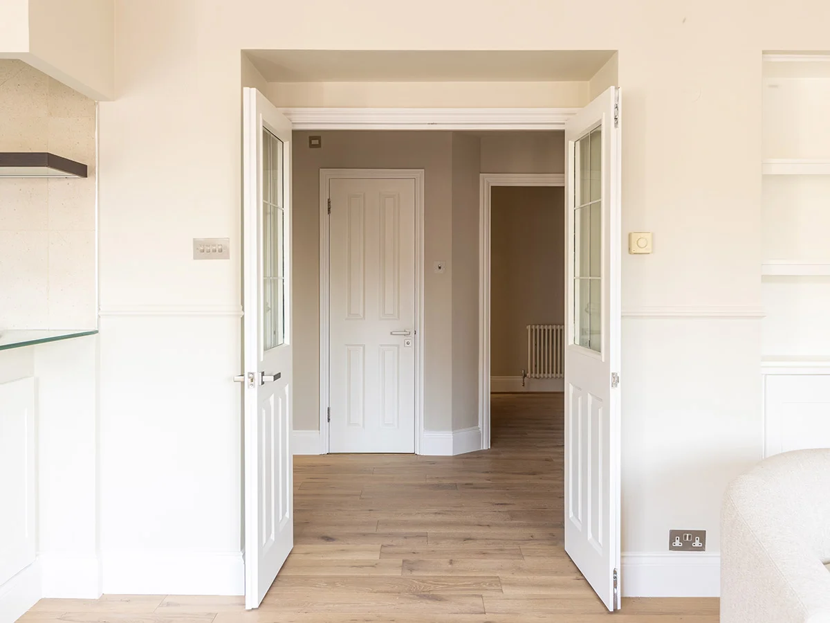 Entrance view showing transformation from compact layout to a more open and spacious interior design
