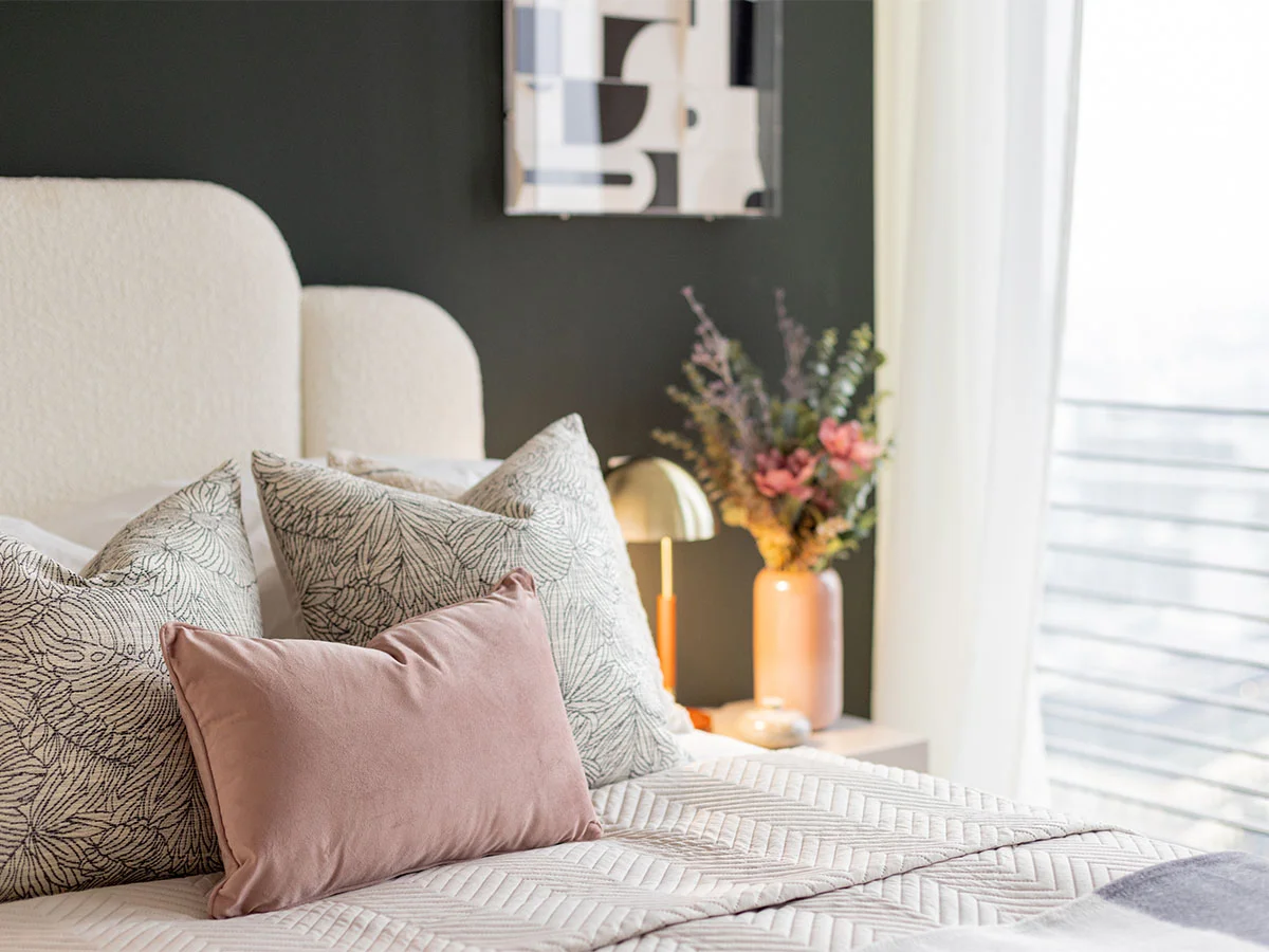 Modern bedroom styling with coordinated cushions and decor from diamond furniture package