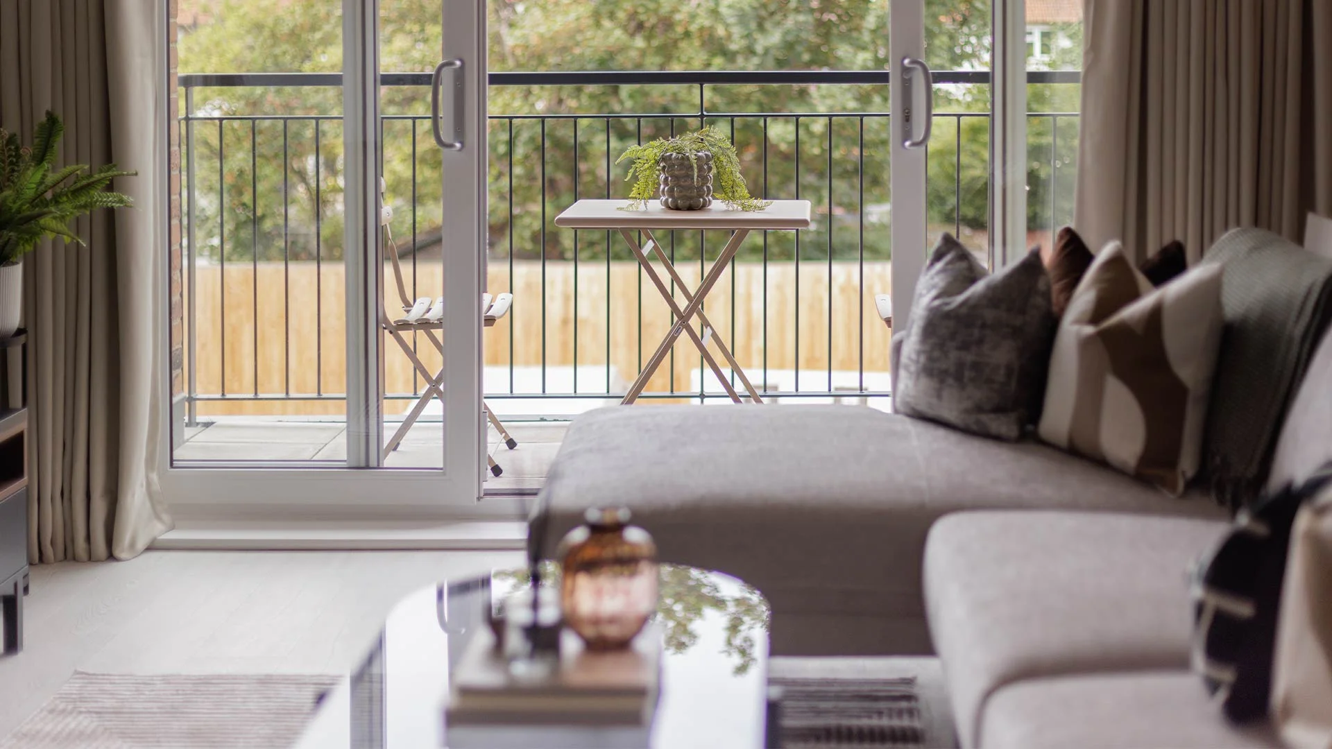 Furnished living room with balcony in London expat apartment