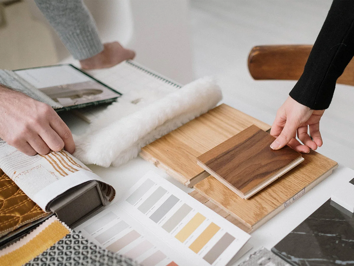 Interior designers selecting materials for furniture package in London
