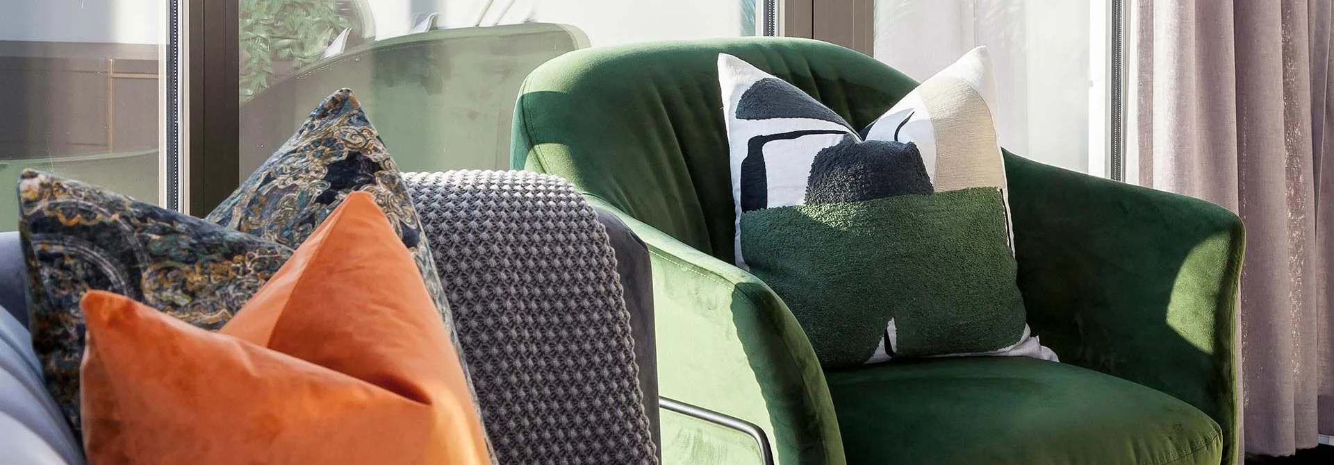 Velvet chair with cushions showcasing furniture sourcing and soft furnishings