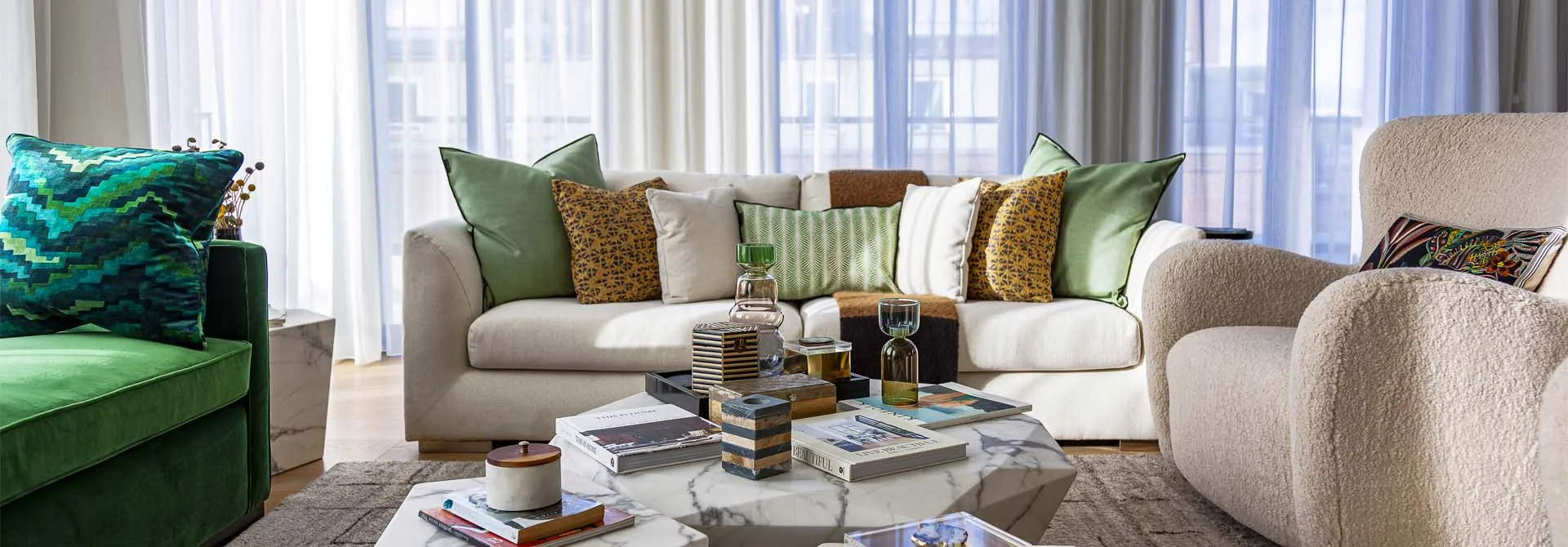 High-end staging for a London flat featuring marble tables and bespoke furniture for investor appeal.