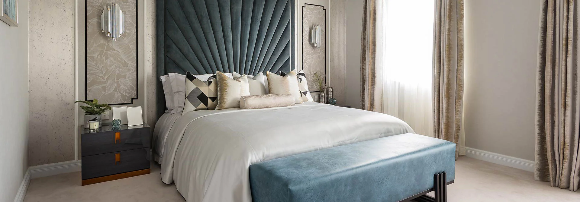 Luxury bedroom transformation with a fluted velvet headboard and silk bedding to increase rental value in London.
