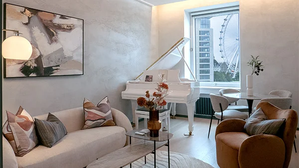 A bright modern living room with stylish seating and contemporary décor, featuring elegant window curtains Dubai homeowners love