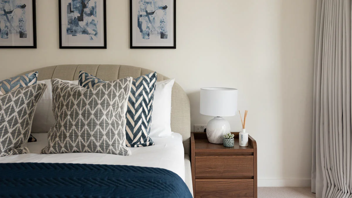 Stylish sales suite interior design showcasing green velvet chairs and sofa. Highlights furnishing packages appeal