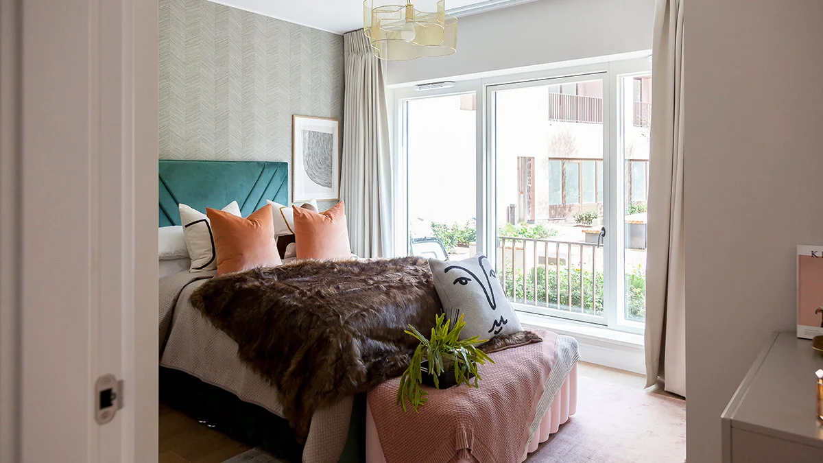 Vibrant green and pink detailed bedroom staging in a Dubai flat, demonstrating high-impact interior design for rental appeal