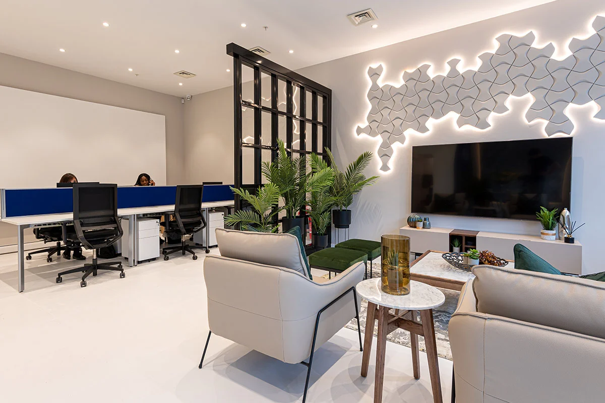 Modern office interior with workspace desks and lounge seating area design
