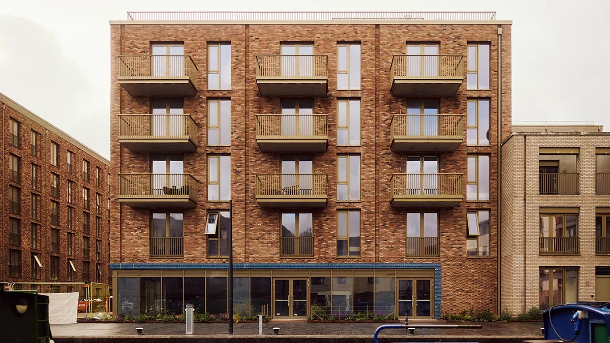 Vibrant green and pink detailed bedroom staging in a Dubai flat, demonstrating high-impact interior design for rental appeal