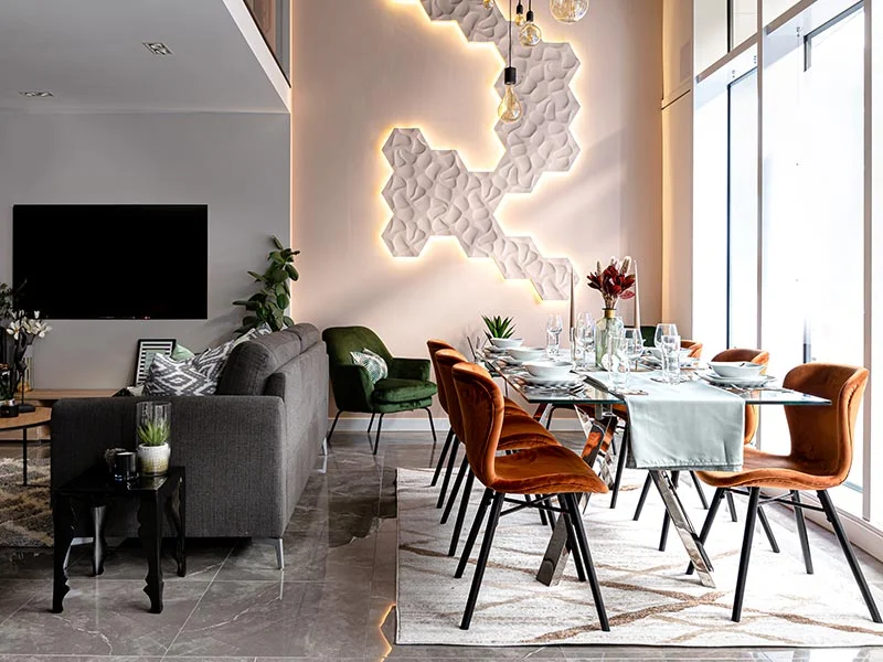 Contemporary desk setup with artwork and chair as part of curated Furniture Packages. give in humanised way