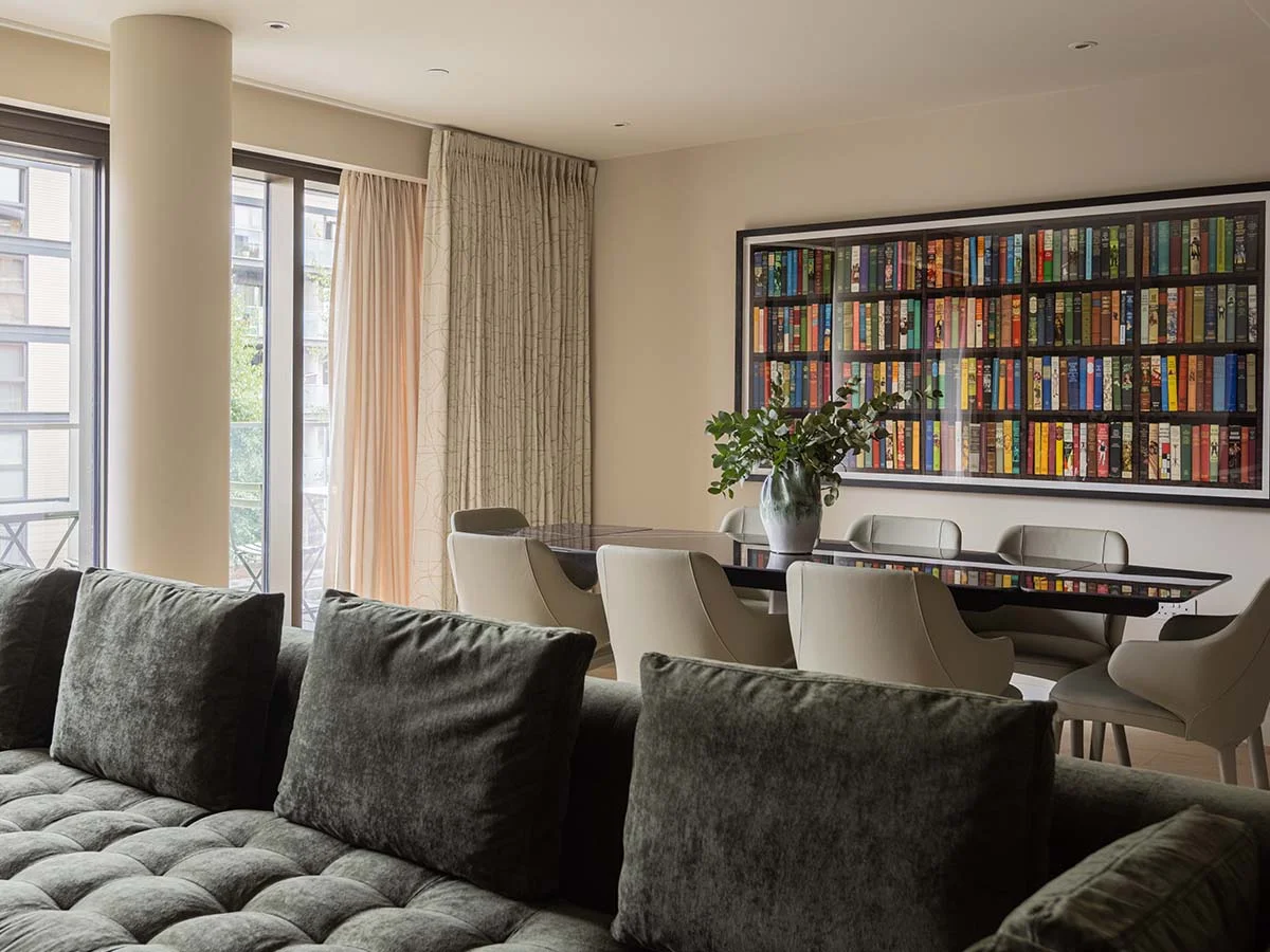 Modern dining set with large wall art in an open-plan London flat transformation