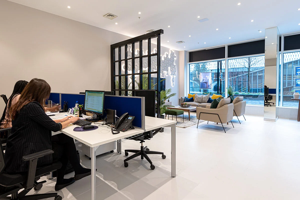 Open plan office interior design with employees working and collaborative workspace layout