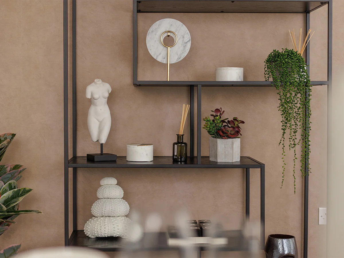 Decorative shelving with plants and accessories in London show home interior styling