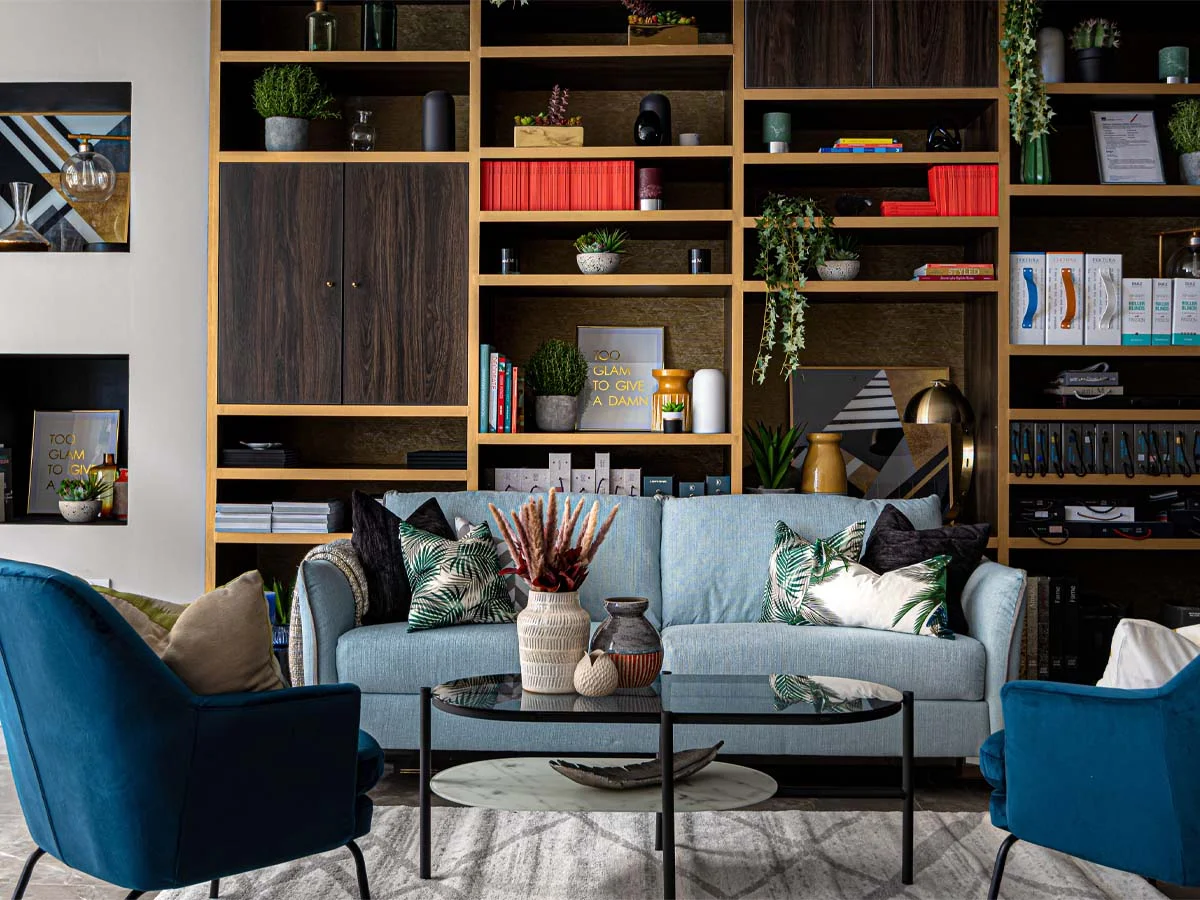 showroom display wall with styled shelving and furniture merchandising design