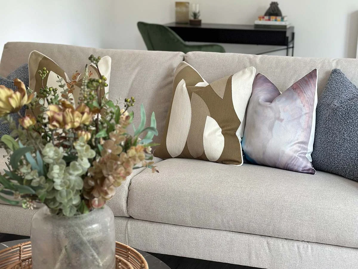 Modern sofa set with cushion pillows in a stylish living room interior