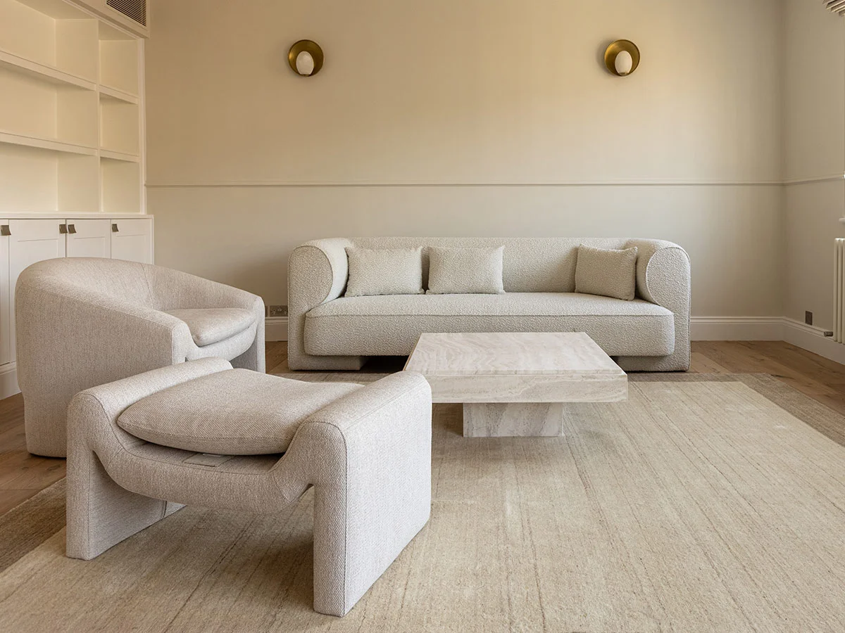 Living room after renovation showing improved layout and spacious contemporary design