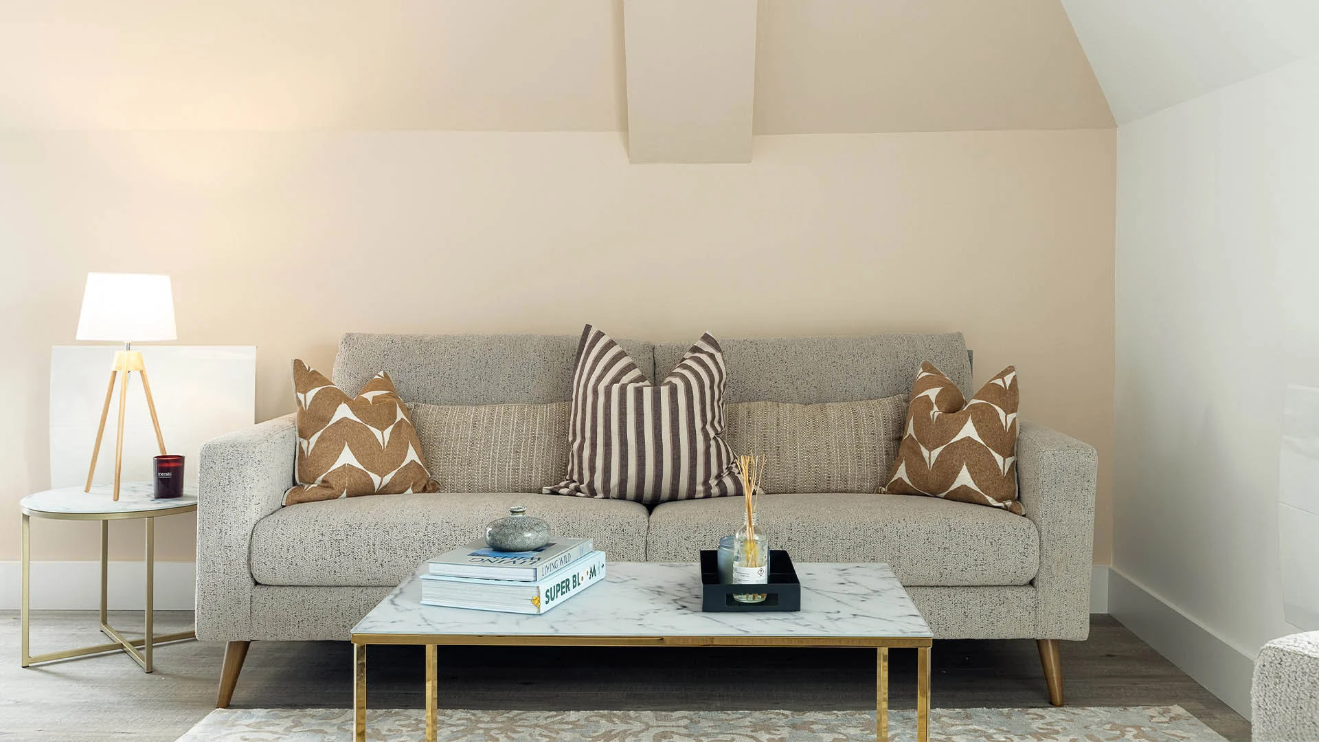 Modern living room with sofa coffee table and decor from tailored furniture package London