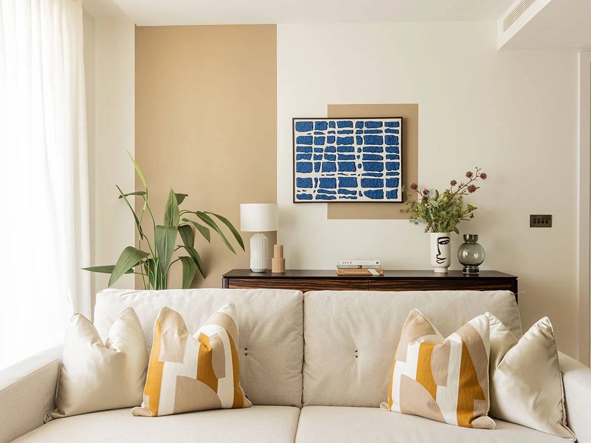 Contemporary living room with styled sofa and artwork in White City London apartment