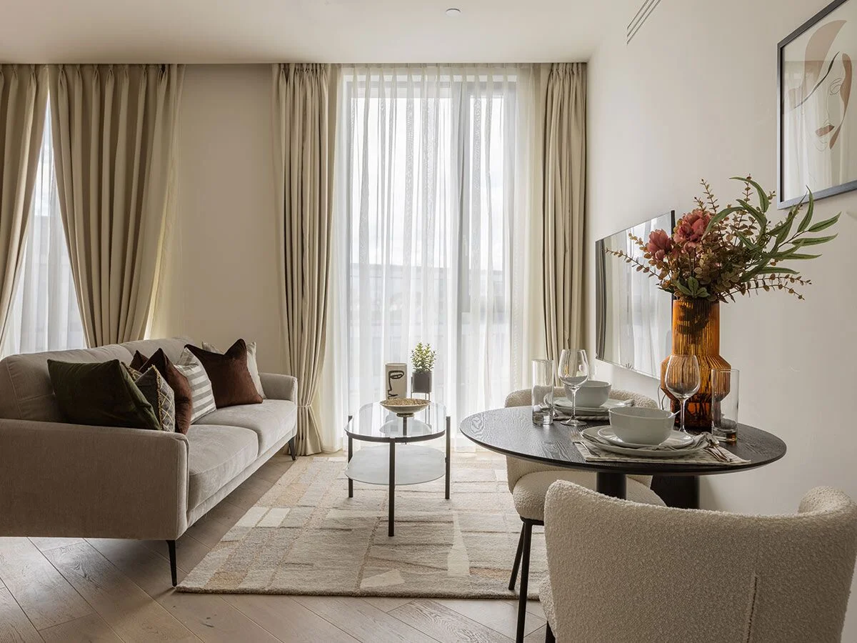 Modern dining space with styled table and artwork, reflecting interior design services in Dubai