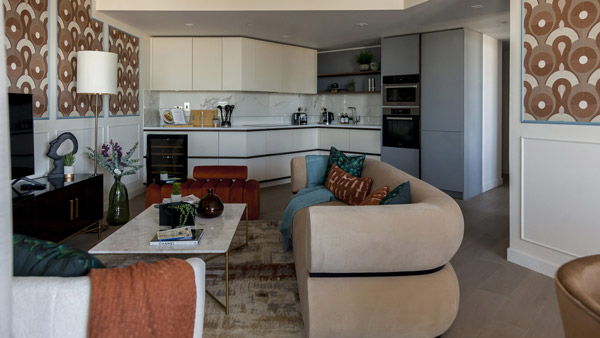 A well-appointed living area with modern seating, greenery, and décor, showcasing expertly crafted Build-to-Rent Furniture Packages