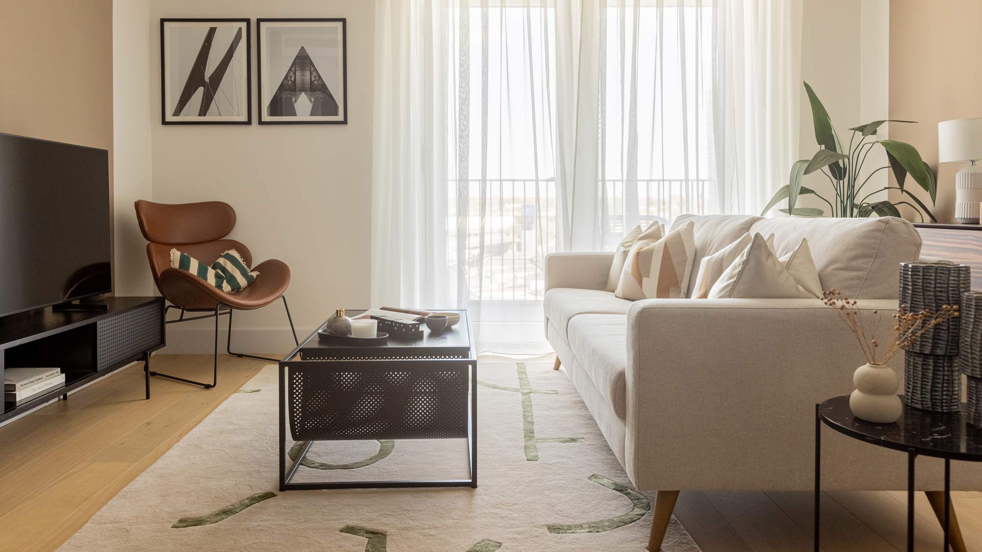 Design your home with British expertise using stylish furniture in Dubai, shown in a bright modern living space with curated décor