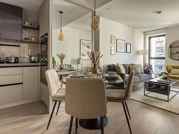 Modern open-plan apartment featuring a stylish dining setup and contemporary living area, showcasing Long-Let Furniture Packages in Dubai designed for comfort and elegance