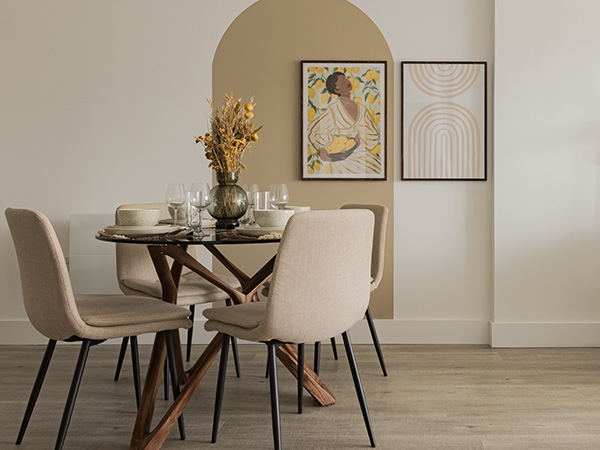 Modern, staged dining area in a London flat with arch accent, demonstrating the impact of professional furnishing