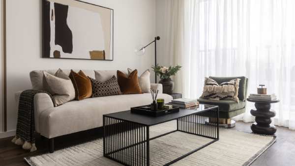 A bright modern living room with stylish seating and contemporary décor, featuring elegant window curtains Dubai homeowners love