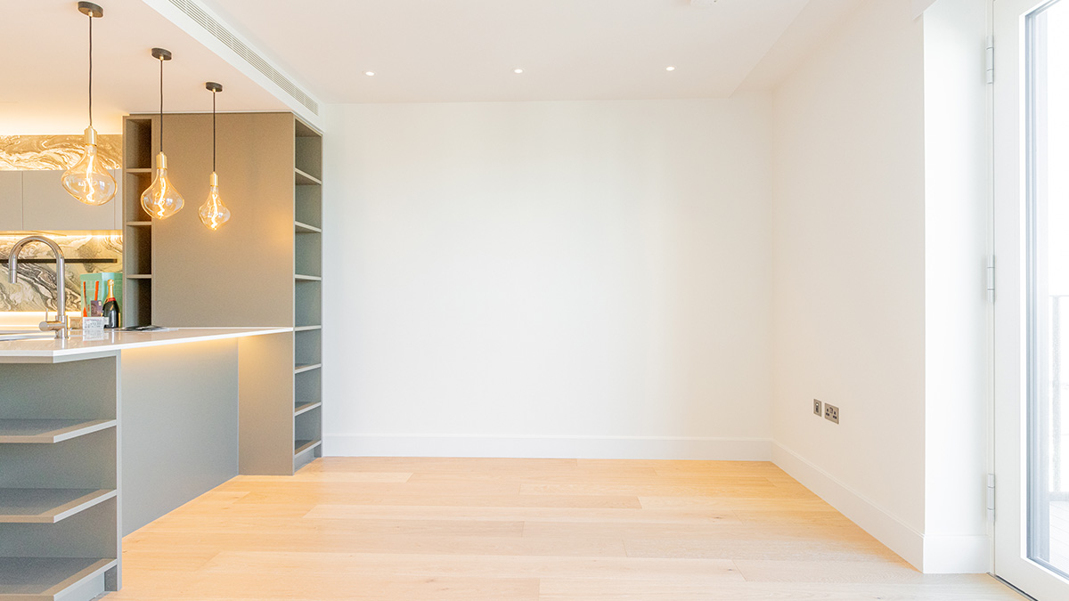 Before photo of an unfurnished London apartment dining space at before furnishing package installation