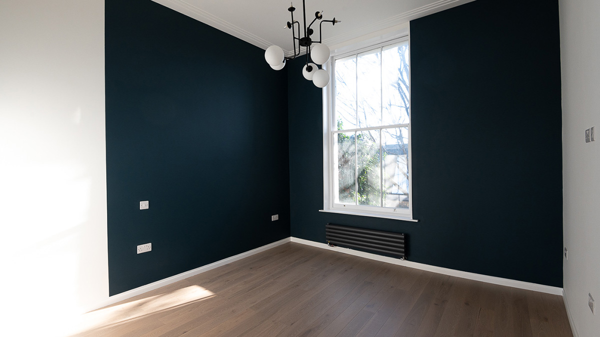 Before furnishing: Empty living room in a Dubai flat. Awaiting professional furnishing packages for overseas investors