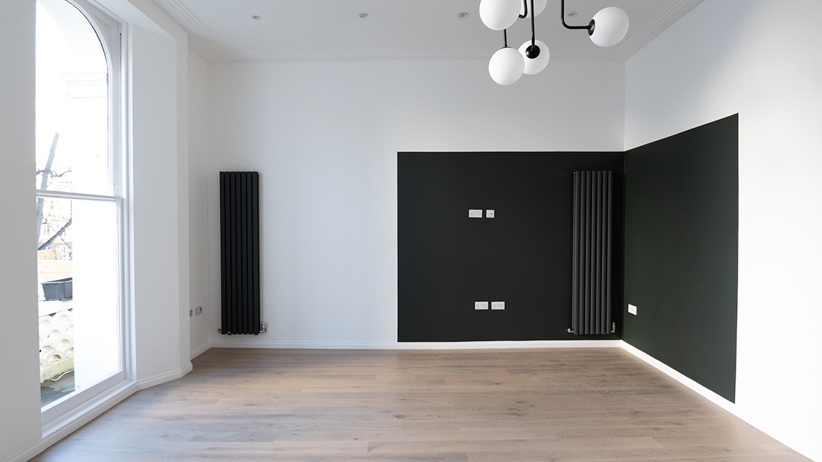Before furnishing: Empty living room in a Dubai flat. Awaiting professional furnishing packages for overseas investors