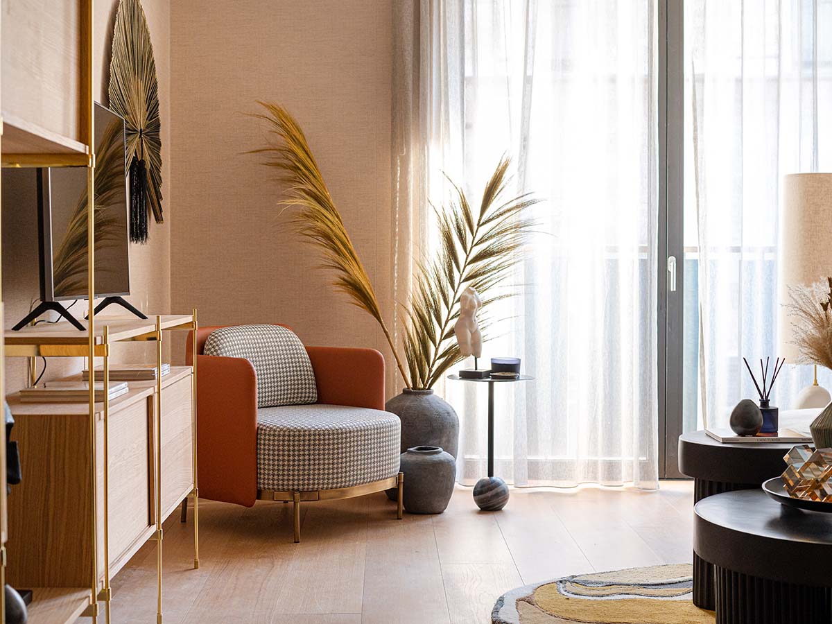 Professionally furnished London flat bedroom with stylish bedding and contemporary art, appealing to overseas investors